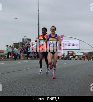 Manchester, UK. 10th May, 2015.  Jo Pavey (Exeter Harriers) leads Tiki Gelana (Ethiopia), but Tiki overtakes her to finish 8th in 33.12 mins, with Jo 10th in 33. Credit:  John Fryer/Alamy Live News Stock Photo