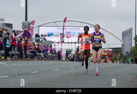 Manchester, UK. 10th May, 2015.  Jo Pavey (Exeter Harriers) leads Tiki Gelana (Ethiopia), but Tiki overtakes her to finish 8th in 33.12 mins, with Jo 10th in 33. Credit:  John Fryer/Alamy Live News Stock Photo