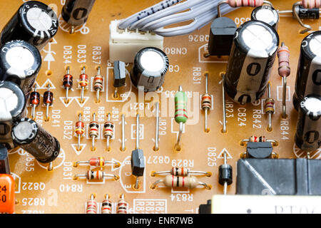 Close up of electronic printer circuit board inside a DVD player. Printed circuits leading to black coated transistors and resistors. Stock Photo
