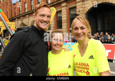 Manchester, UK. Sunday 10 May 2015. The city hosted the Morrison's Great Manchester Run in the heart of the city centre. Long Jumper Greg Rutherford and (right) TV presenter Louise Minchin who is running for Leukaemia & Lymphoma Research. Credit:  Michael Buddle/Alamy Live News Stock Photo
