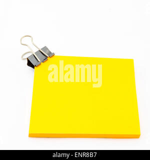 black clip with orange sticky note isolated on white background Stock Photo