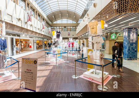 The Porta shopping mall at Kyoto station. Retail products on display in the main aisle of the mall with shops on either side. Glass atrium type roof. Stock Photo