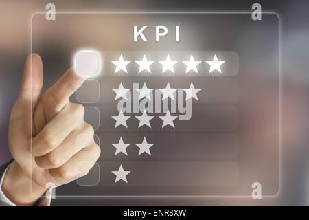 business hand clicking KPI or Key Performance Indicator on virtual screen interface Stock Photo