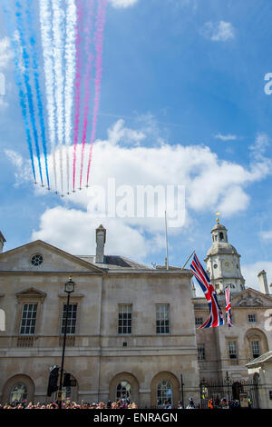 London, UK. 10th May, 2015. The flypast of the Red Arrows passes over Horse Guards Parade. VE Day 70 commemorations -  marking historic anniversary of end of the Second World War in Europe. following a Service of Thanksgiving at Westminster Abbey, a parade of Service personnel and veterans and a flypast - down whitehall and into Horse Guards Parade. Credit:  Guy Bell/Alamy Live News Stock Photo