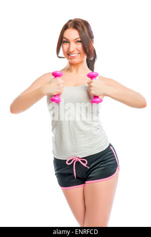 Portrait of a brunette with pink dumbbells Stock Photo