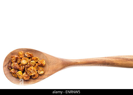 dried goldenberries on a wooden spoon isolated on white with a clipping path Stock Photo