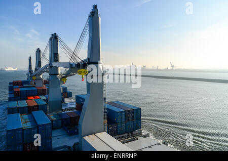 A container ship sailing into the port of Rotterdam, Netherlands Stock Photo