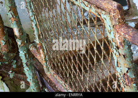 Rusting metal on staircase in building in decline. Stock Photo