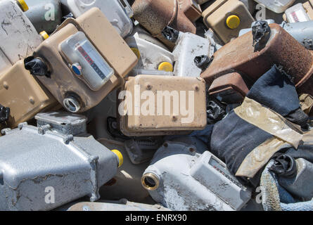 rusted old abandoned gas counters in waste landfill Stock Photo