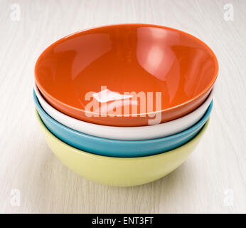 Colorful plates on the dining table light Stock Photo