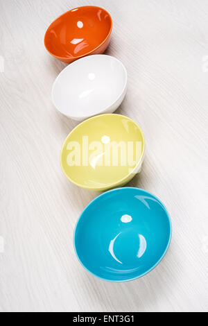 Colorful plates on the dining table light Stock Photo