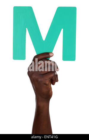 Hand holding letter M from alphabet isolated on a white background Stock Photo