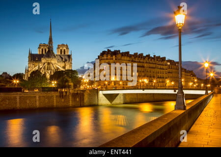 Twilight over River Seine, Cathedral Notre Dame and buildings of Paris, France Stock Photo