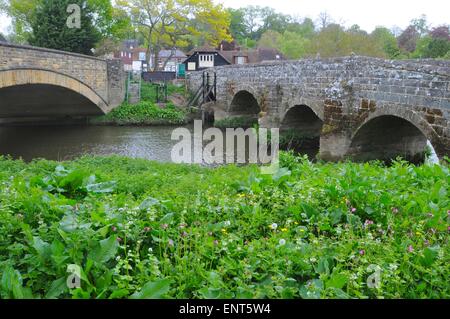 The two ancient bridges which cross the River Arun at Pulborough in Sussex Stock Photo