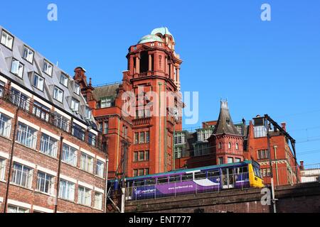 Pacer diesel multiple unit train on elevated track between Oxford Rad and Piccadilly railway stations in Manchester city centre. Stock Photo