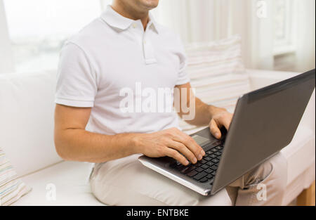 close up of man working with laptop at home Stock Photo