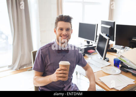 happy creative male office worker drinking coffee Stock Photo