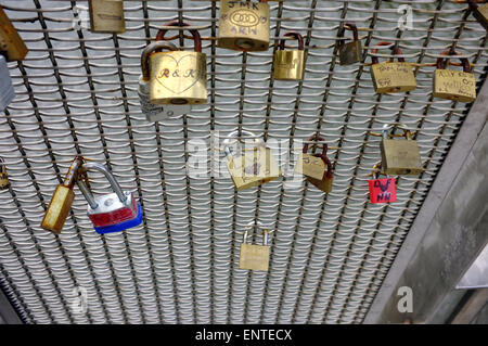 Metal fencing on a bridge in Bristol covered in love locks. Stock Photo