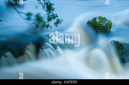 Water flowing down a small stream Stock Photo