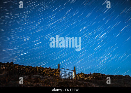 Stars, star trail in the night sky - starry sky in the dark, UK Stock Photo
