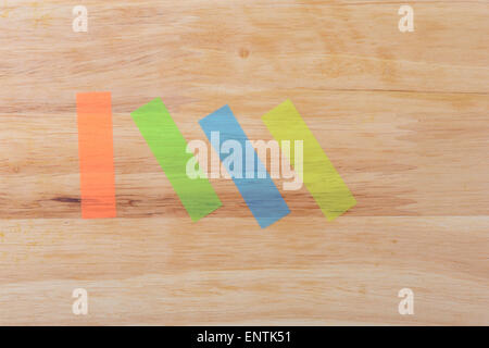 notes four colours in vertical and diagonal on wood background Stock Photo