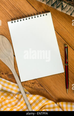 A Cooks Notepad on a farmhouse kitchen table - Space for Text Stock Photo
