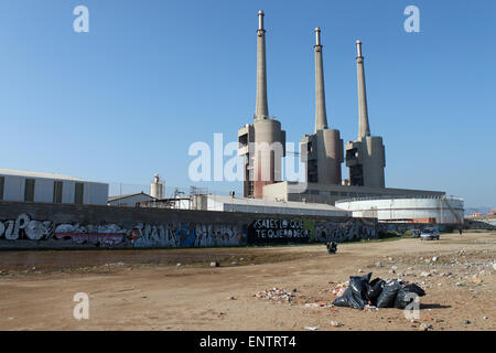 Three chimneys of closed Besòs power thermal station from beach,  Sant Adrià de Besòs, Barcelona, Catalonia, Spain. Stock Photo