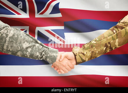 Soldiers handshake and US state flag - Hawaii Stock Photo