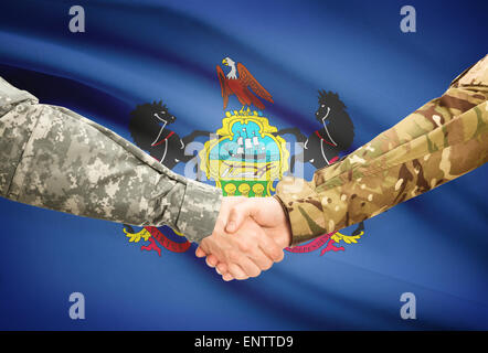 Soldiers handshake and US state flag - Pennsylvania Stock Photo