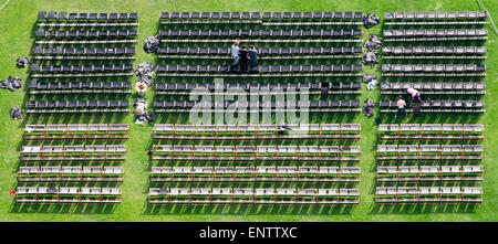 Munich, Germany. 11th May, 2015. Workers set up rows of chairs for an outdoor cinema at the Olympiapark (Olympic Park) in Munich, Germany, 11 May 2015. PHOTO: PETER KNEFFEL/dpa/Alamy Live News Stock Photo