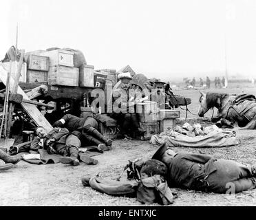 Officers of The Royal Army Medical Corps are catching up on paperwork whilst the rest the platoon sleep and relax in Northern France. September 2 1914 Stock Photo