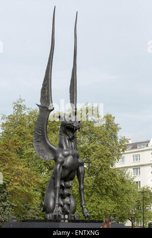 London, UK. 11 May 2015. Halcyon Gallery unveils 'She Guardian', a monumental sculpture by Russian sculptor and artist Dashi Namdakov at Marble Arch. The bronze statue rises 11 metres from claw to wing tip and depicts a mystical and fantastical female feline protecting her young. 'She Guardian' took more than two years to create and weighs 4,300 kg. Dashi Namdakov's work is currently on show at Halcyon Gallery, London. Stock Photo