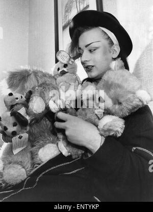 Culture club lead singer boy George with his cuddly toys he has saved from his fans. 8th April 1983. Stock Photo