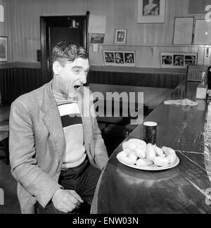 Sausage eating champion: Joe Steele of Bedlington Northumberland champion raw sausage eating champion. Circa 1965. Stock Photo