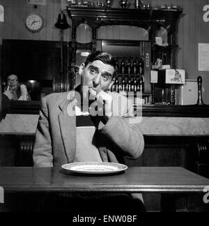 Sausage eating champion: Joe Steele of Bedlington Northumberland champion raw sausage eating champion. Circa 1965. Stock Photo