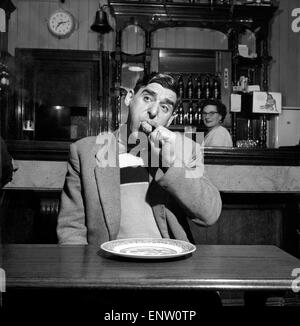 Sausage eating champion: Joe Steele of Bedlington Northumberland champion raw sausage eating champion. Circa 1965. Stock Photo