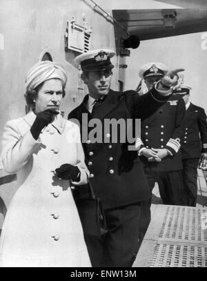 Queen Elizabeth II visits HMS Norfolk and is shown around by Prince Charles. July 1972. Stock Photo