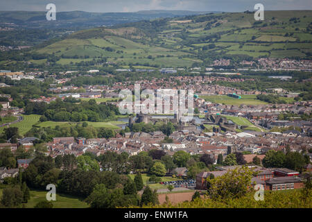 Caerphilly Castle almost hidden amongst the town houses, viewed from Caerphilly Mountain, Wales, UK Stock Photo