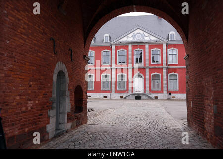 Main building of the Stavelot Abbey seen through a archway. The Abbey of the Prince-Bishops of Stavelot, Belgium. Stock Photo