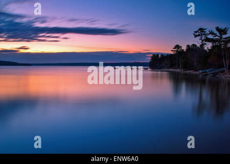 Lake Superior Sunrise. Sunrise reflections along the shores of a calm Lake Superior. Stock Photo
