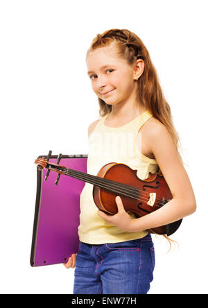 Small girl holding purple folder and violin Stock Photo