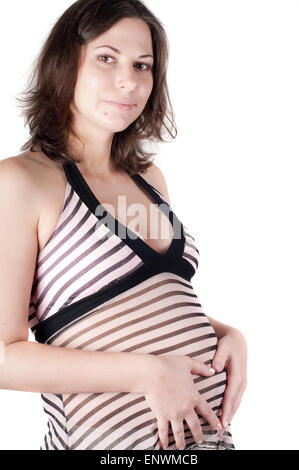 Pregnant woman hands in form of heart sign Stock Photo