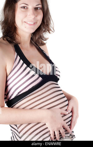 Pregnant woman hands in form of heart sign Stock Photo