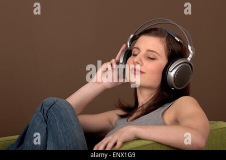 Student series - Beautiful brown hair woman with headphones Stock Photo