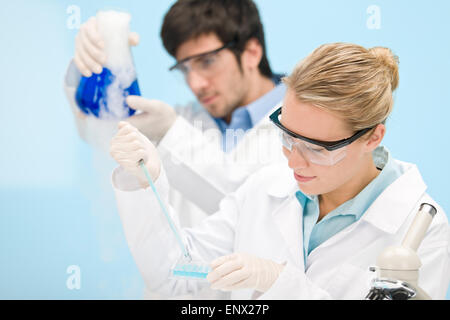 Flu virus experiment -  scientist in laboratory Stock Photo