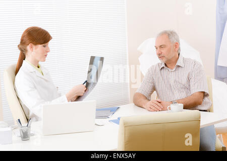 Doctor office - female physician patient x-ray Stock Photo