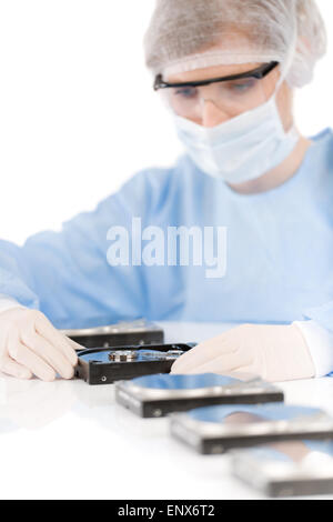 Female computer engineer - woman repair hard disc, sterile Stock Photo