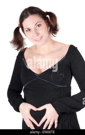 Pregnant woman hands in form of heart sign Stock Photo