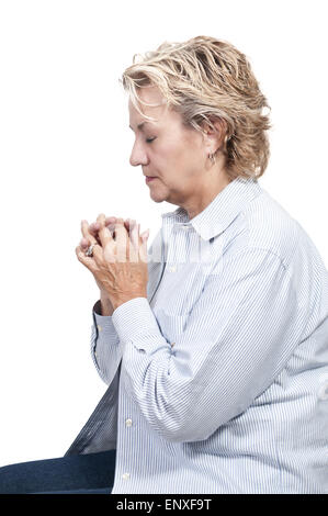 Woman praying Stock Photo