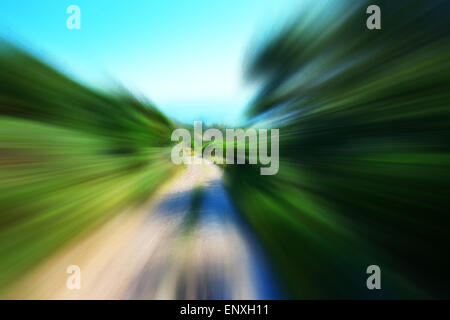 Mountain bike driving on country road Stock Photo